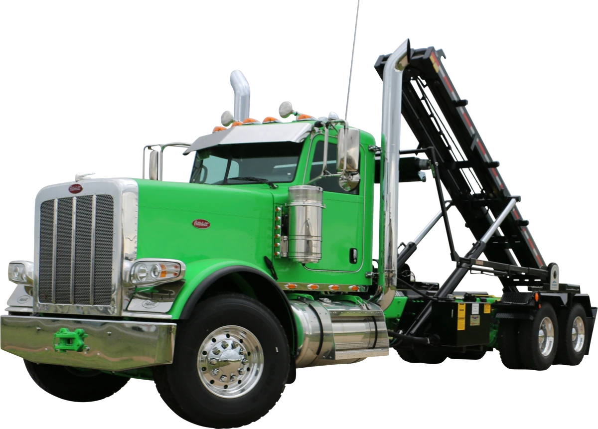 Roll-off truck with raised hoist